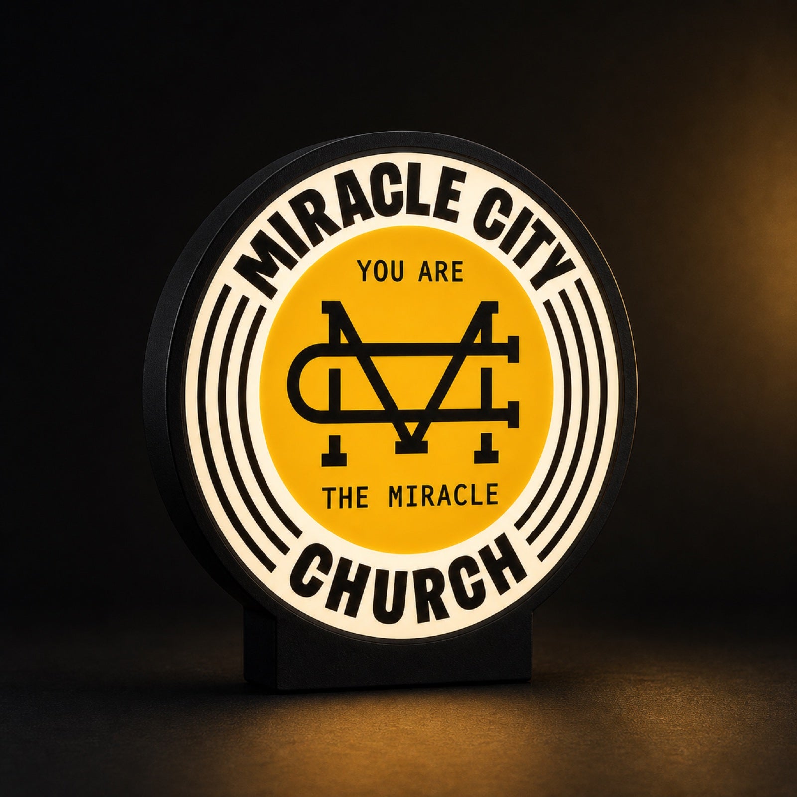 Miracle City Church light box — illuminated church logo